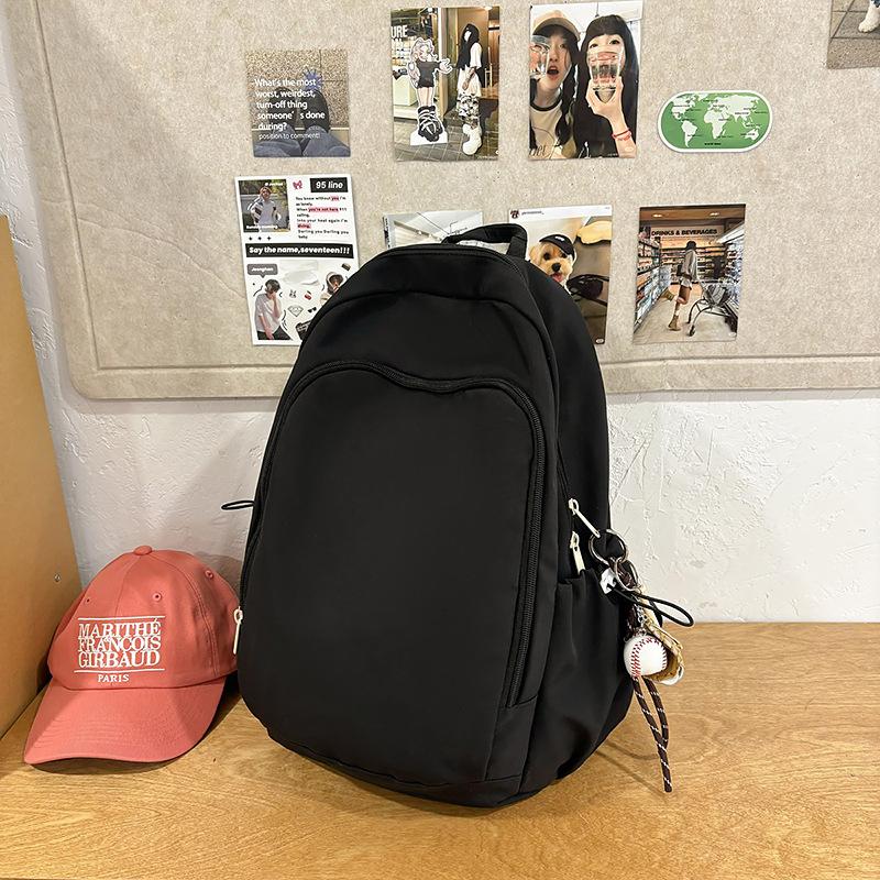 Casual solid color large-capacity schoolbag 2025 new versatile junior high school backpack college student travel backpack tide