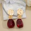 European and American exaggerated geometric earrings female mosquito coil disc retro style earrings light luxury niche design burgundy earrings