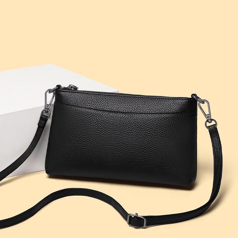 Frühling und Sommer neue schwarze Litschi-Muster weiches Leder Unterarmtasche vielseitige Schulter-Umhängetasche lässige Pendlertasche