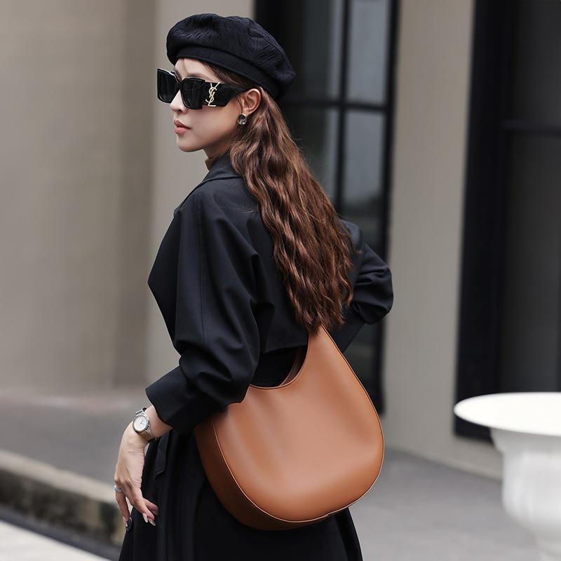 New niche design special-shaped crescent bag, semi-round bag, one shoulder and underarm women's bag, leather messenger tote bag.