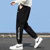 Li Ning Sports Fashion Series Letter Mid Waist Comfortable Breathable Versatile Cuffed Knitted Sports Pants Men bottoms Black AKLUE43-1