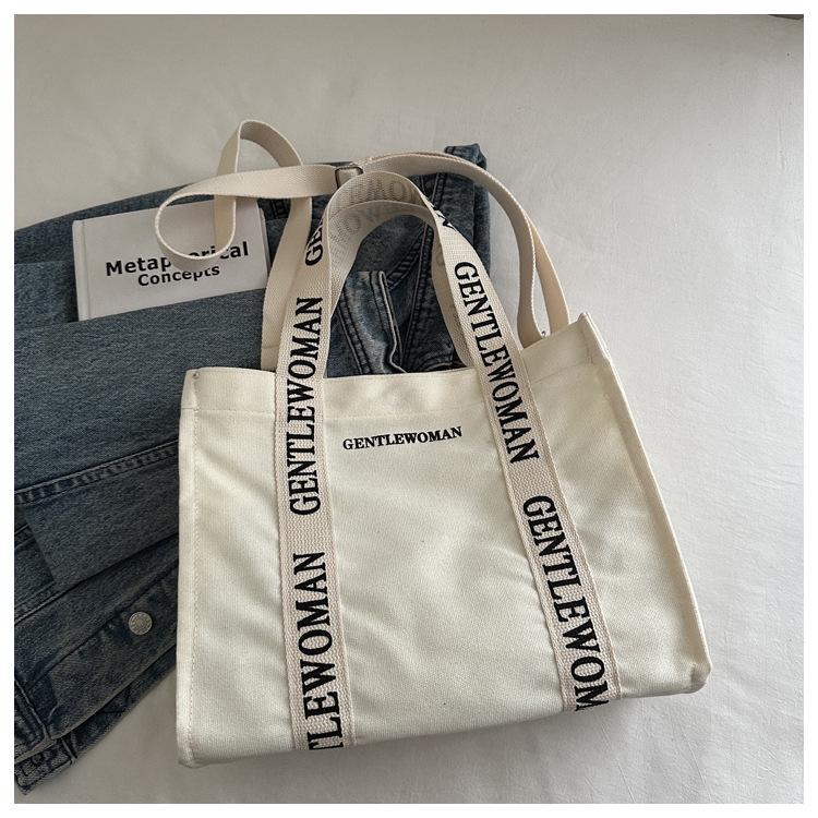 2025 Women's Color-Blocking Canvas Handbag: Trendy Crossbody & Shoulder Bag with Colorful Strap