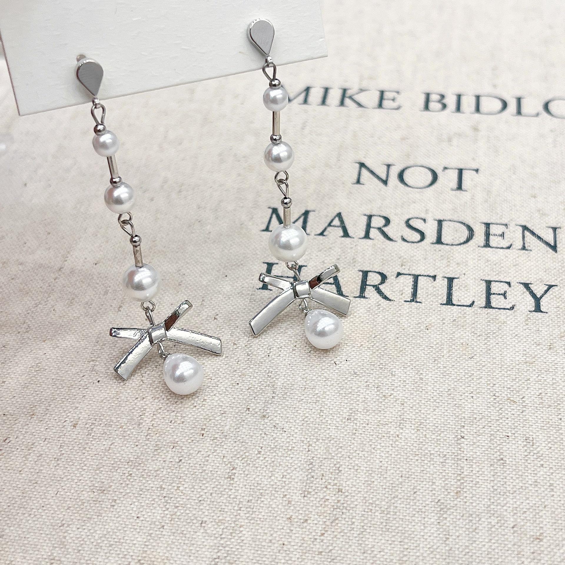 

Элегантные оригинальные серьги-бантики с жемчугом: Длинная, легкая роскошь с милым ретро-оттенком E0781 Bow Pearl Earrings