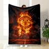 A Fiery Manchester United Logo Emerges Against Smoke and a Dark Background. for All Seasons Blanket Lunch Break Throw Gift