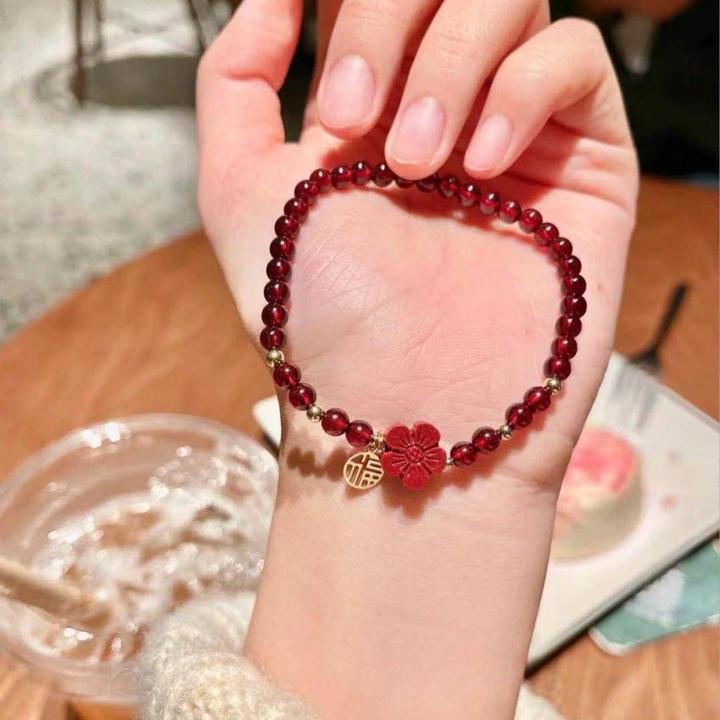 Here's a small red flower for you: a hand-woven bracelet made of cinnabar red garnet, the same style as the one featured on Little Red Book