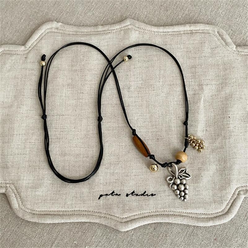 Stylish Alloy Accent Necklace With Sliding Closure Braided Cord and Natural Wood Materials