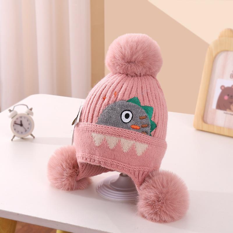 A children's dinosaur wool hat winter new cartoon jacquard knitted hat medium and older boys and girls ear hats