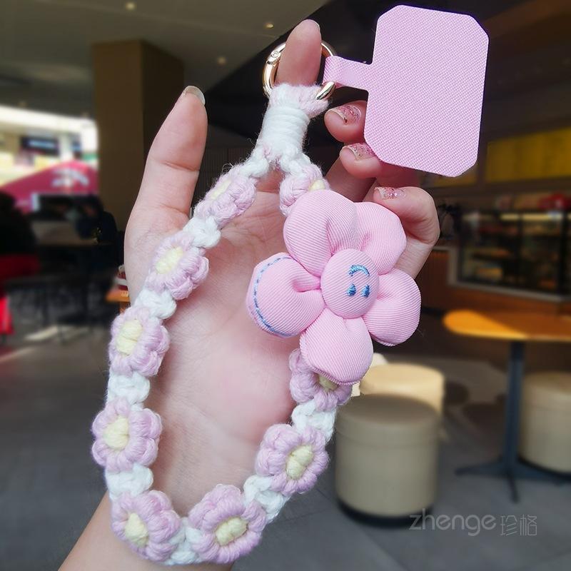 

Smiley face flower woven mobile phone lanyard women s ins fragrant wrist short hand-woven boutique small fresh pinkish white smiley flower lanyard + pink clip