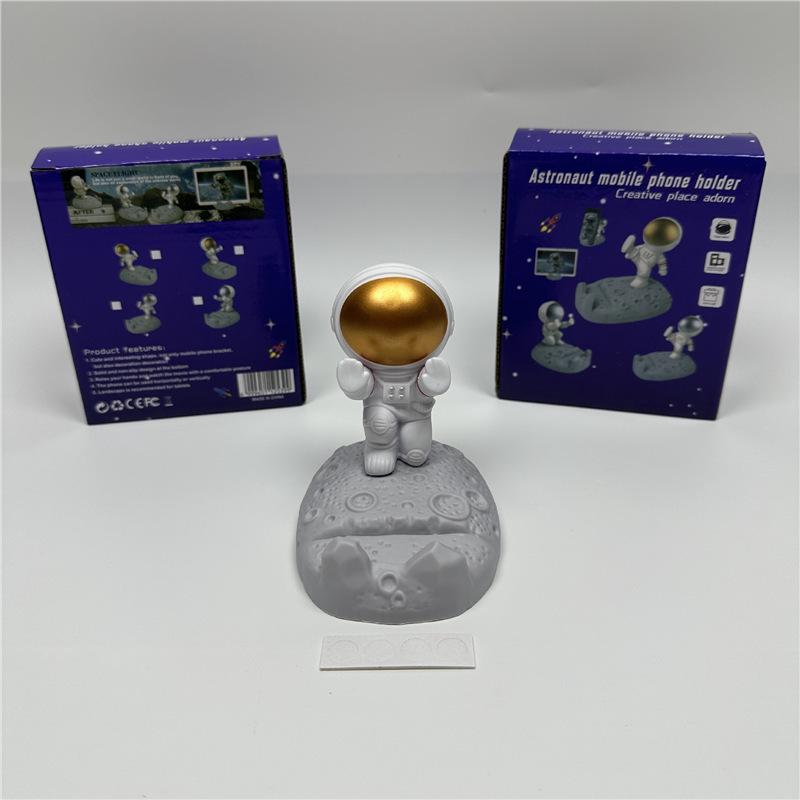 Astronaut Figurine Phone Holder: Creative Plastic Desktop Decor & Gift