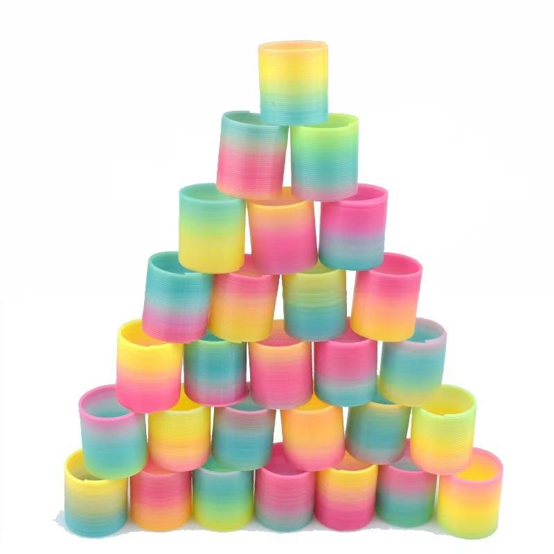 

12PCS Rainbow Magic Springs Circle Toys Діти День народження Сувеніри Розіграші Подарунки Сувеніри Дитячий садок Гість Наповнювачі Pinata