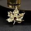 SUYU Women's Light Luxury Vintage Maple Leaf Red Zircon Brooch Elegant Fashionable Versatile Brooch Unique Design