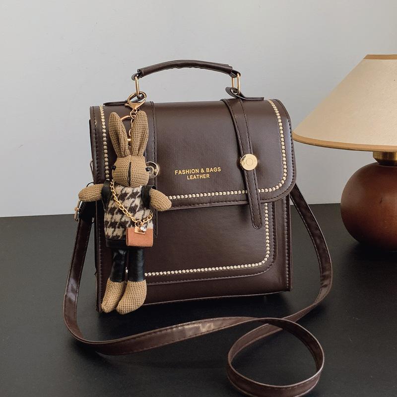 

2025 New British Style Bag Versatile Backpack Women s Handheld Korean Edition Backpack Retro Outward Travel Backpack