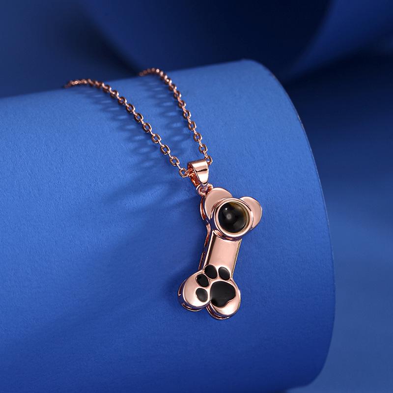 

100 Languages I Love You Projection Necklace with Dog Paw & Pet Imprint – A Unique Christmas Gift.