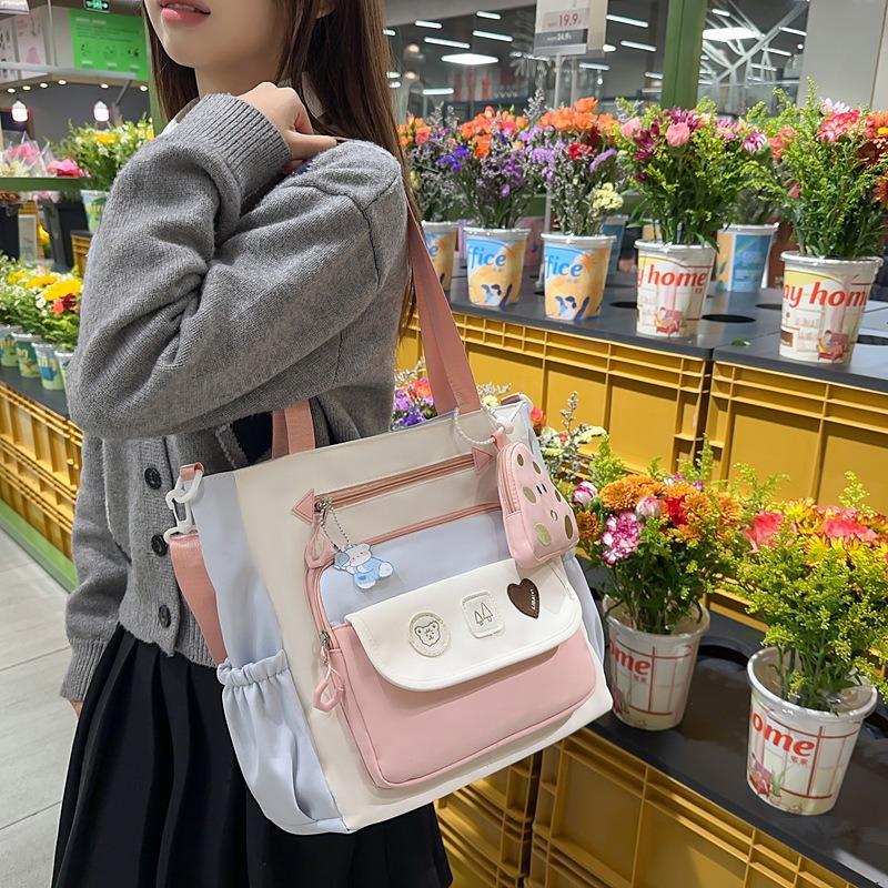Korean version ins exquisite and cute contrasting colors large-capacity student tutoring bag literary and small fresh women's shoulder messenger bag