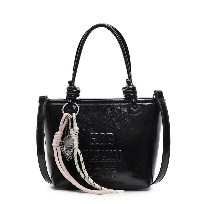2025 popular new niche simple wind hand carrying bucket bag Korean version casual versatile commuter fashion messenger bag women