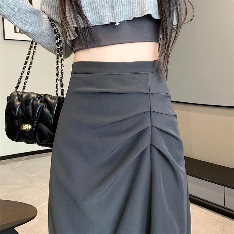 Dámská midi sukně áčkového střihu s vysokým pasem a rozparkem pro raný podzim 2025