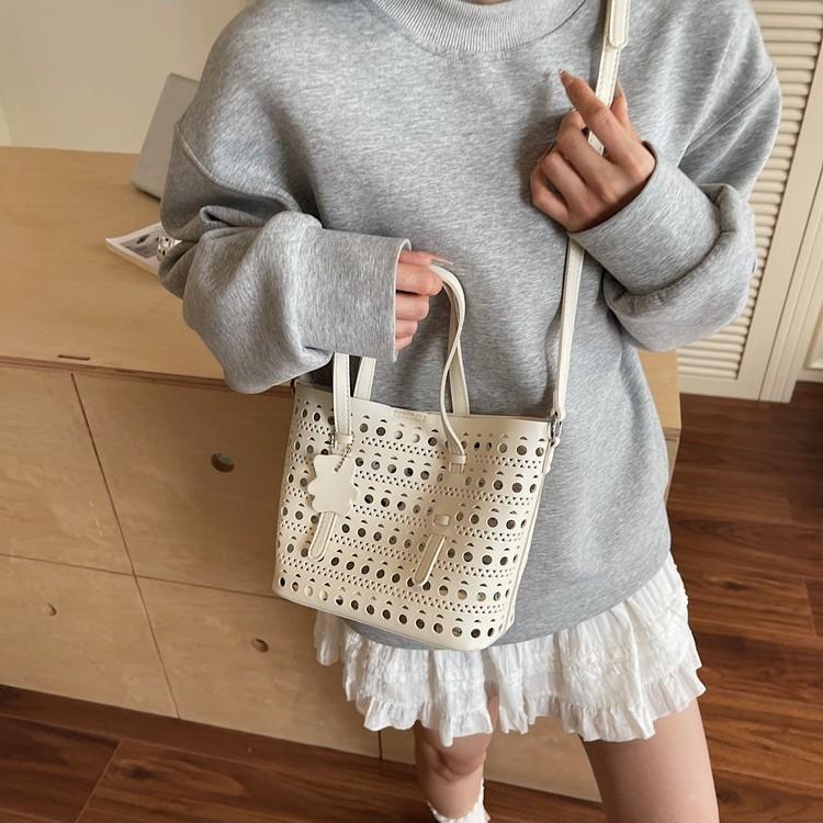 Popular small bag women's summer new versatile hollow messenger bag portable bucket bag