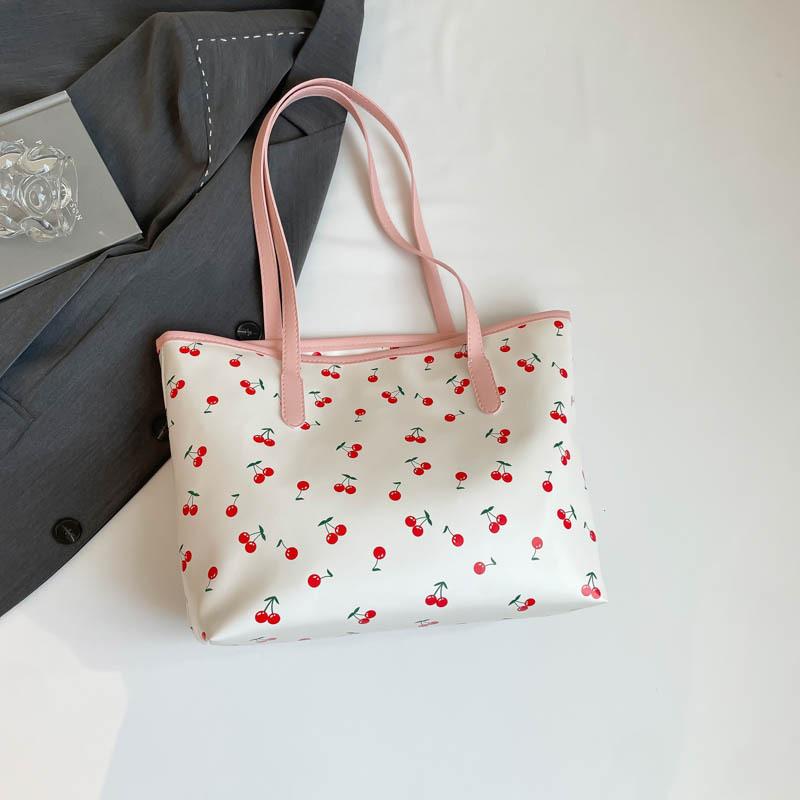 The new beautiful and fresh summer popular versatile large-capacity students commute to class versatile portable shoulder armpit bag