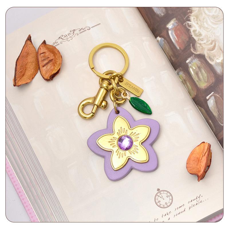 Marque de Luxe Sac Fleur Pendentif Mode Élégant Métal Cuir Créatif Exquis Polyvalent Mignon Accessoires Sac Porte-clés
