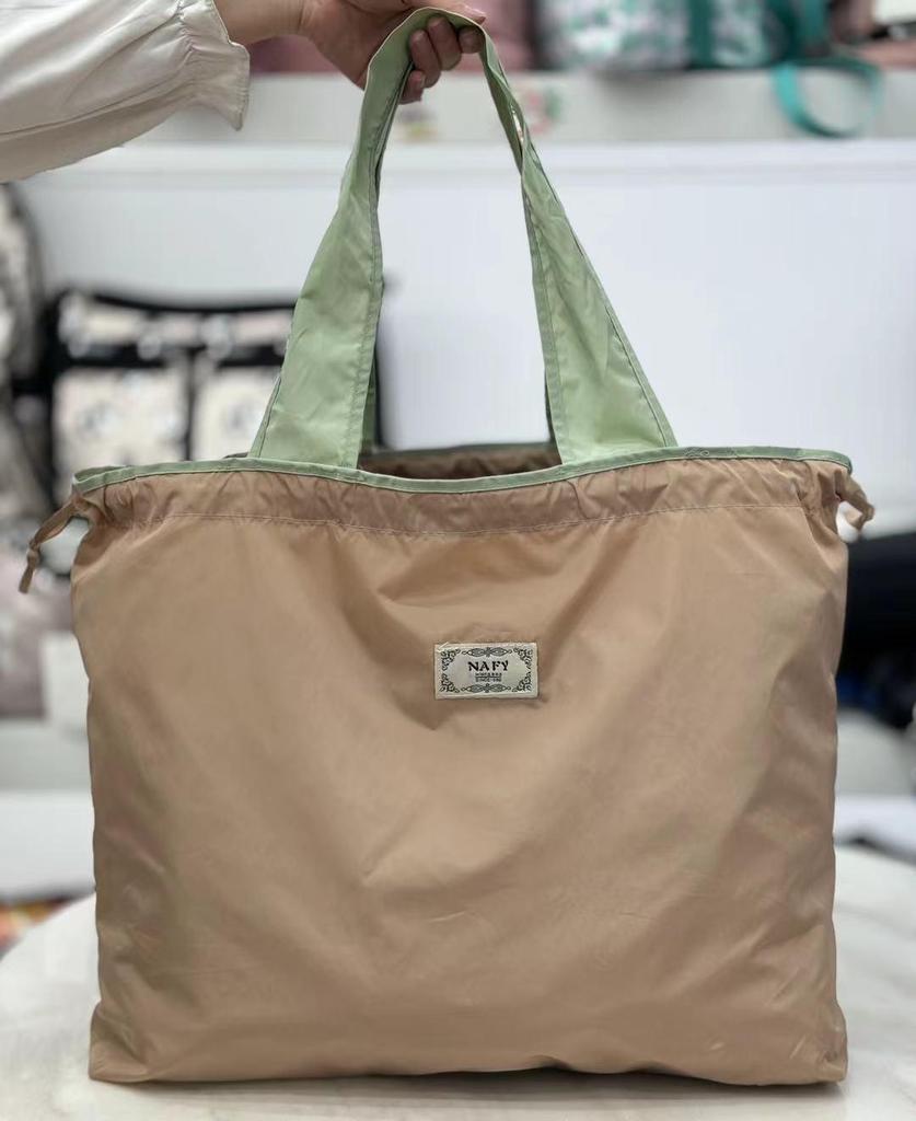 Eco-friendly Lightweight Water-repellent Foldable Shopping Bag with Drawstring Closure and Large Capacity