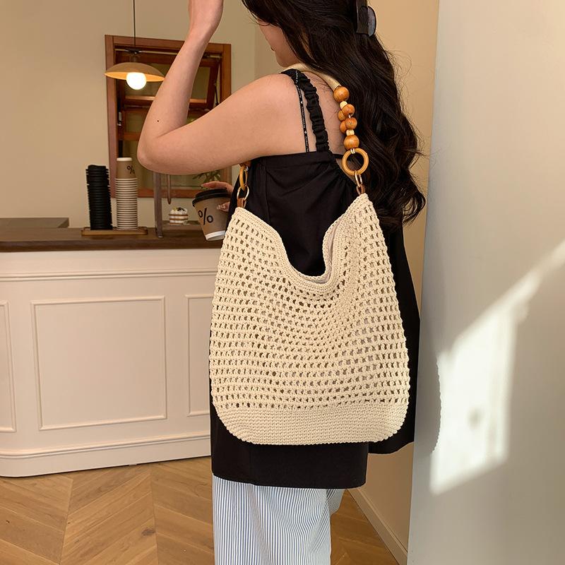 Stylish large-capacity knitted hollow women's tote bag, new exquisite beach vacation hand-woven shoulder bag