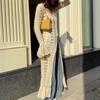 And American Style Sexy Hollow-Out Long Knitted Cardigan for Women with a Design Featuring Ruffles and a Lazy Style, Paired with a Flared Sleeve Dress