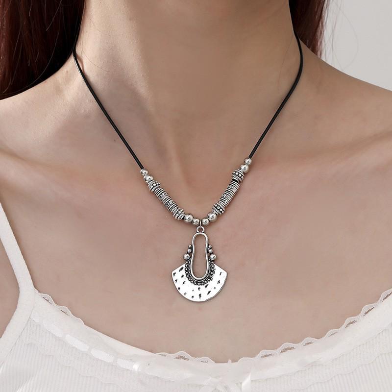 Bohemian Retro Fan-shaped Earring and Necklace Set: Fashionable Hollow-out Vacation Style for Women