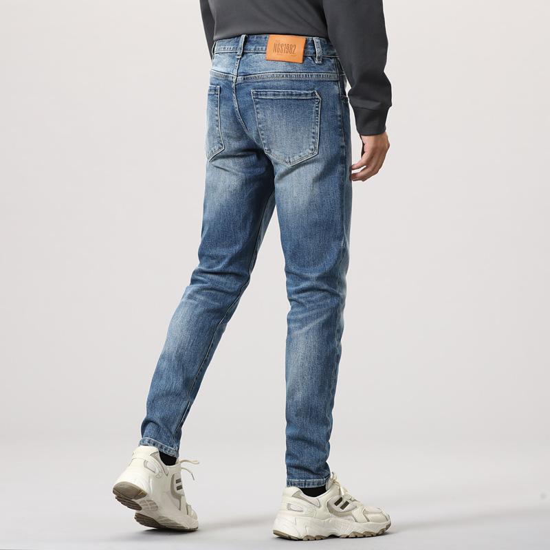 Primăvară New Small Feet Trend Jeans cu talie medie Pantaloni slim pentru bărbați cu elastic