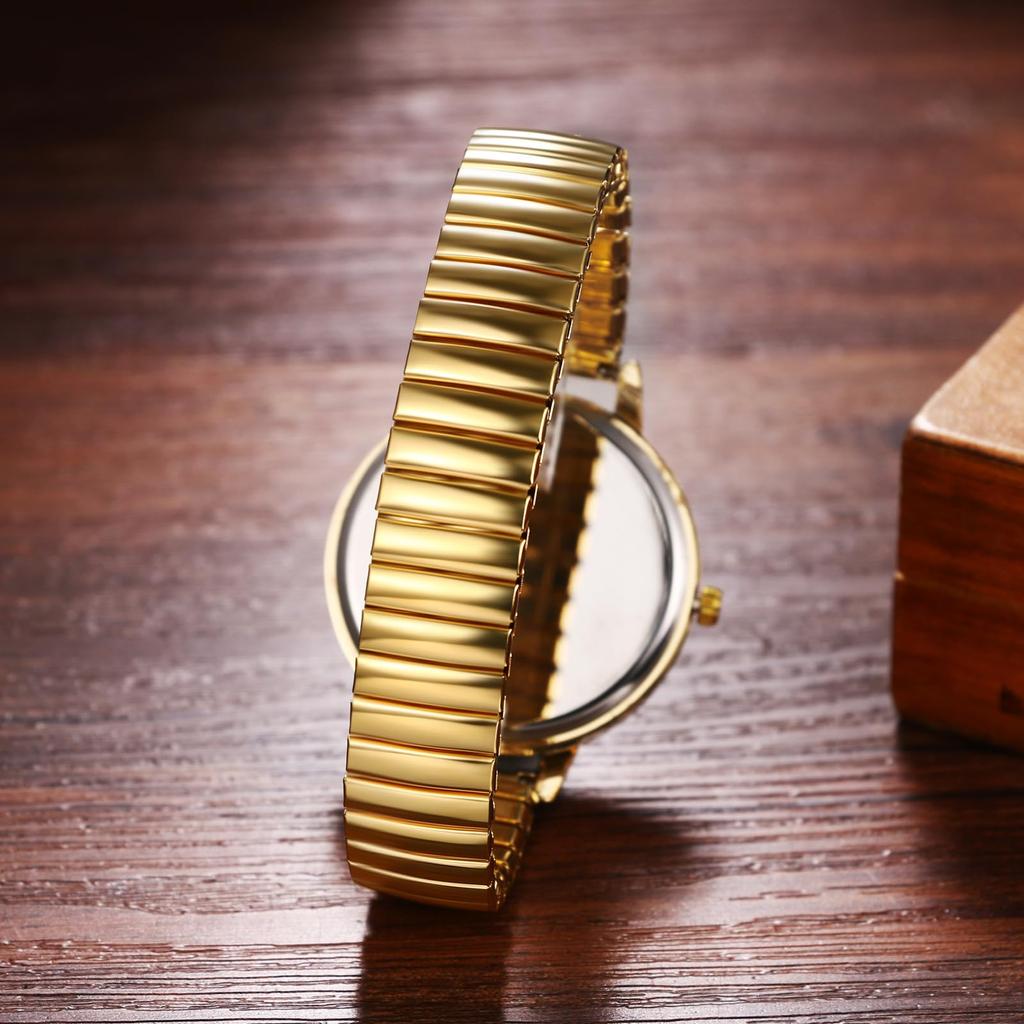 Women's waterproof and rainproof wristwatch with a round dial, large white dial, gold case, gold strap, and stainless steel quartz movement. A