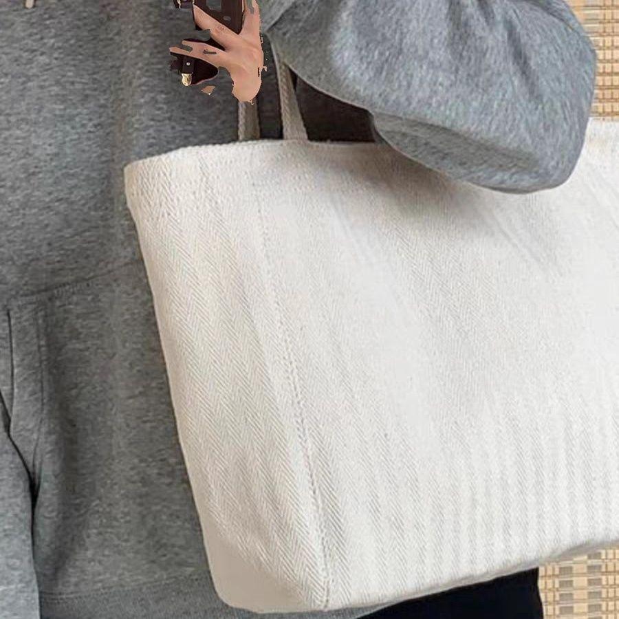 

Elegant Off-White Large-Capacity Canvas Bag for College & Office Use