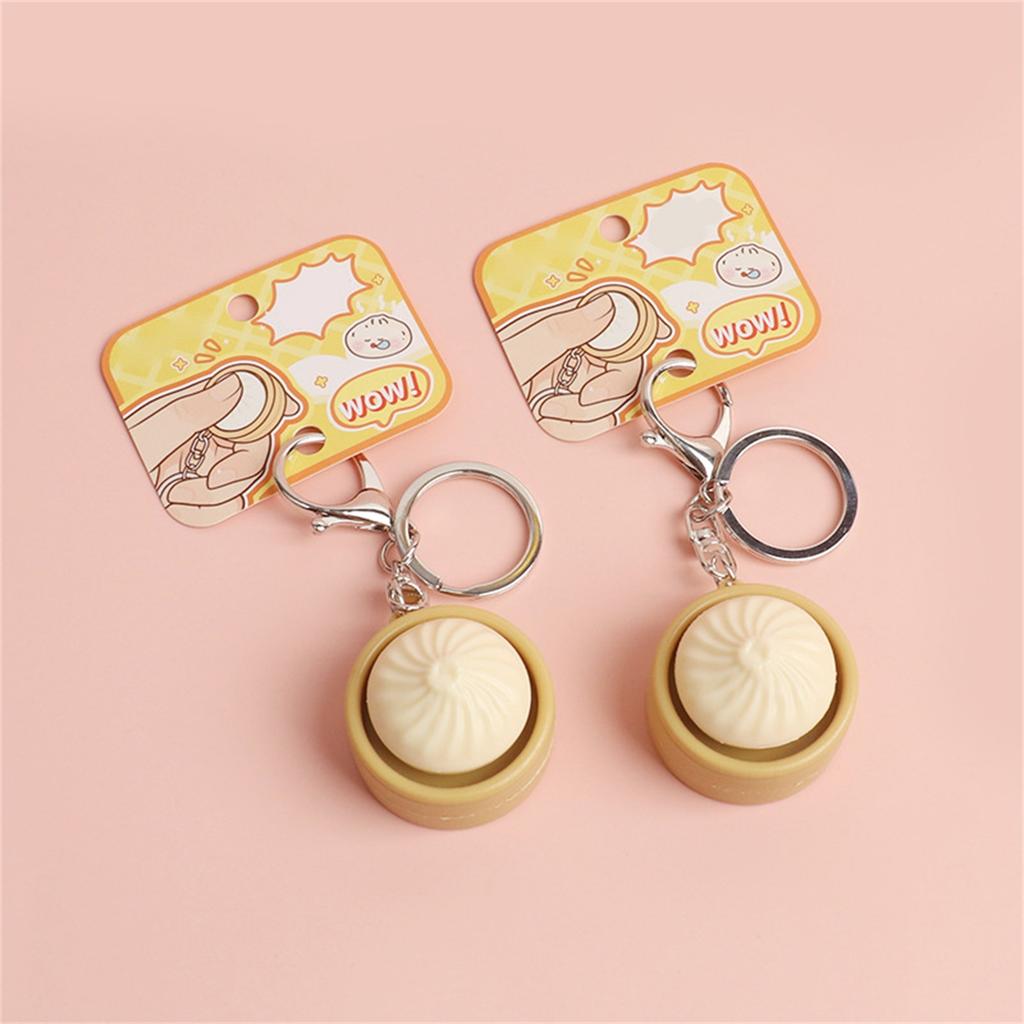 Niedlicher Schlüsselanhänger mit simuliertem gedämpftem Brötchen und Knopf-Dekompressionfunktion, Kreatives Geschenk