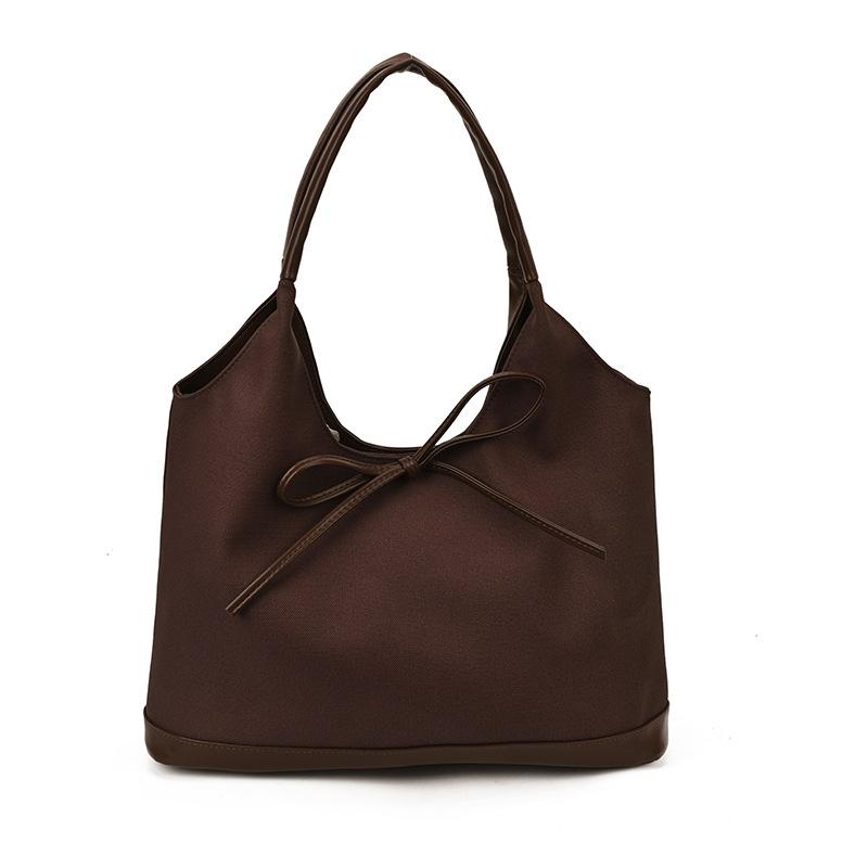 Retro commuter niche bow single shoulder armpit bag 2025 Korean version new fashion simple contrasting color tote bag