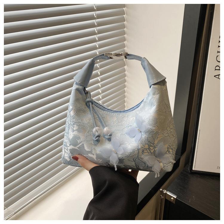 

Ручная переноска Новая китайская сумка-подмышка Женская 2025 Весна Нишевый дизайн На плечо Кроссбоди Женская сумка-подушка синий