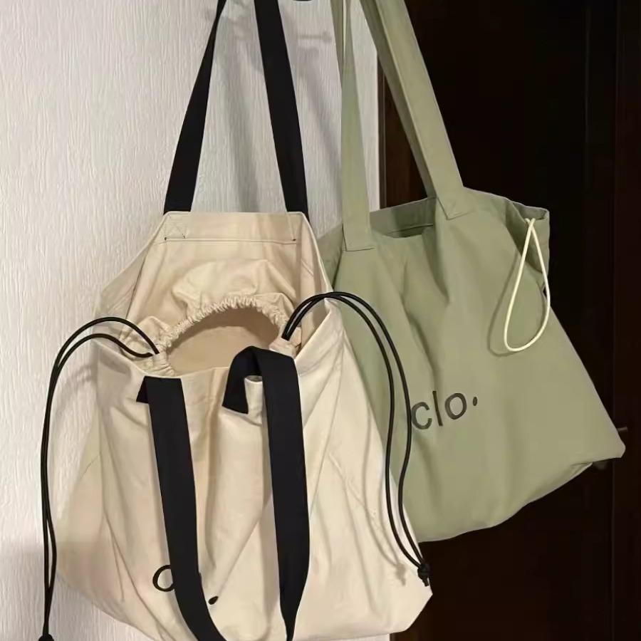 College students commute to class shoulder bag 2024 new large-capacity lazy style versatile tote bag drawstring armpit bag