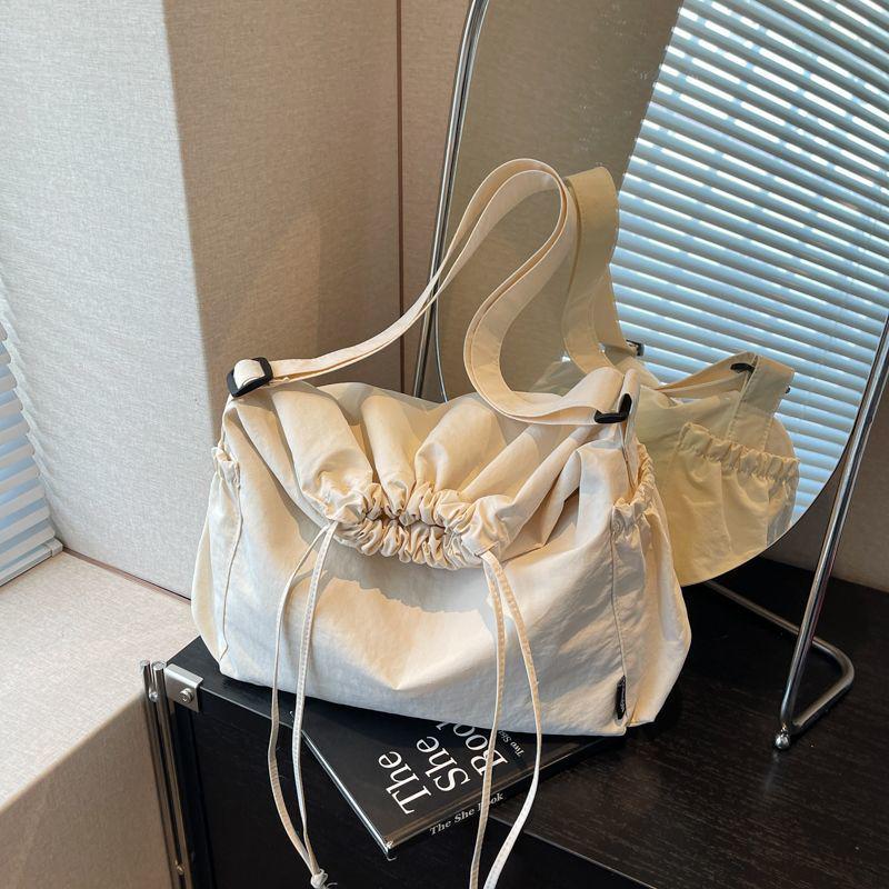 2025 Black Pleated Drawstring Tote - Large Capacity, Versatile Single-Shoulder Crossbody Bag for Casual and Commute Use.