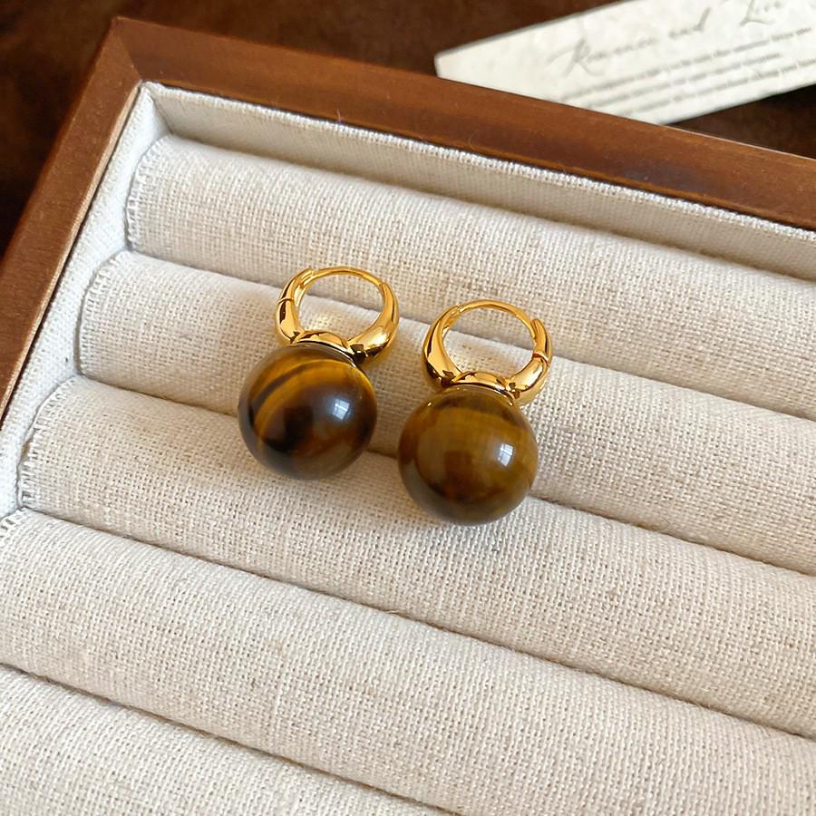 Silver Needle Tiger's Eye Style Earrings: Elegant, Fashionable Studs with Caramel Color Finish.