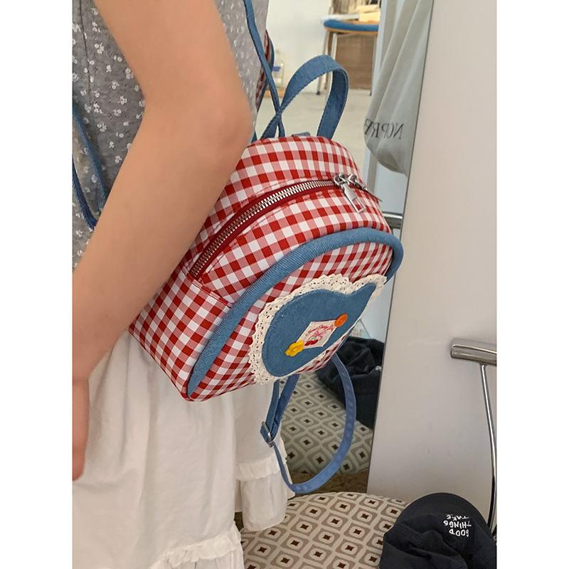 

Casual plaid canvas bag women s 2025 new fashion preppy backpack cartoon girly cute backpack