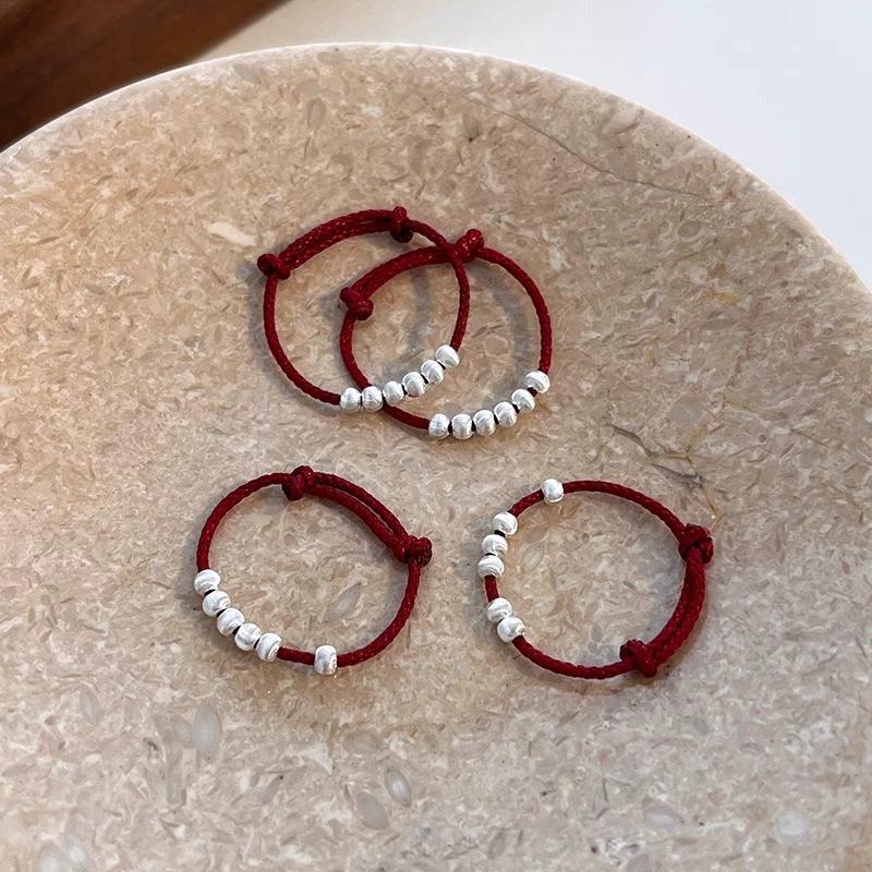 Trendy Ethnic Red String Woven Bead Ring for Women - Simple, Fashionable, Versatile Chinese Style Finger Accessory.