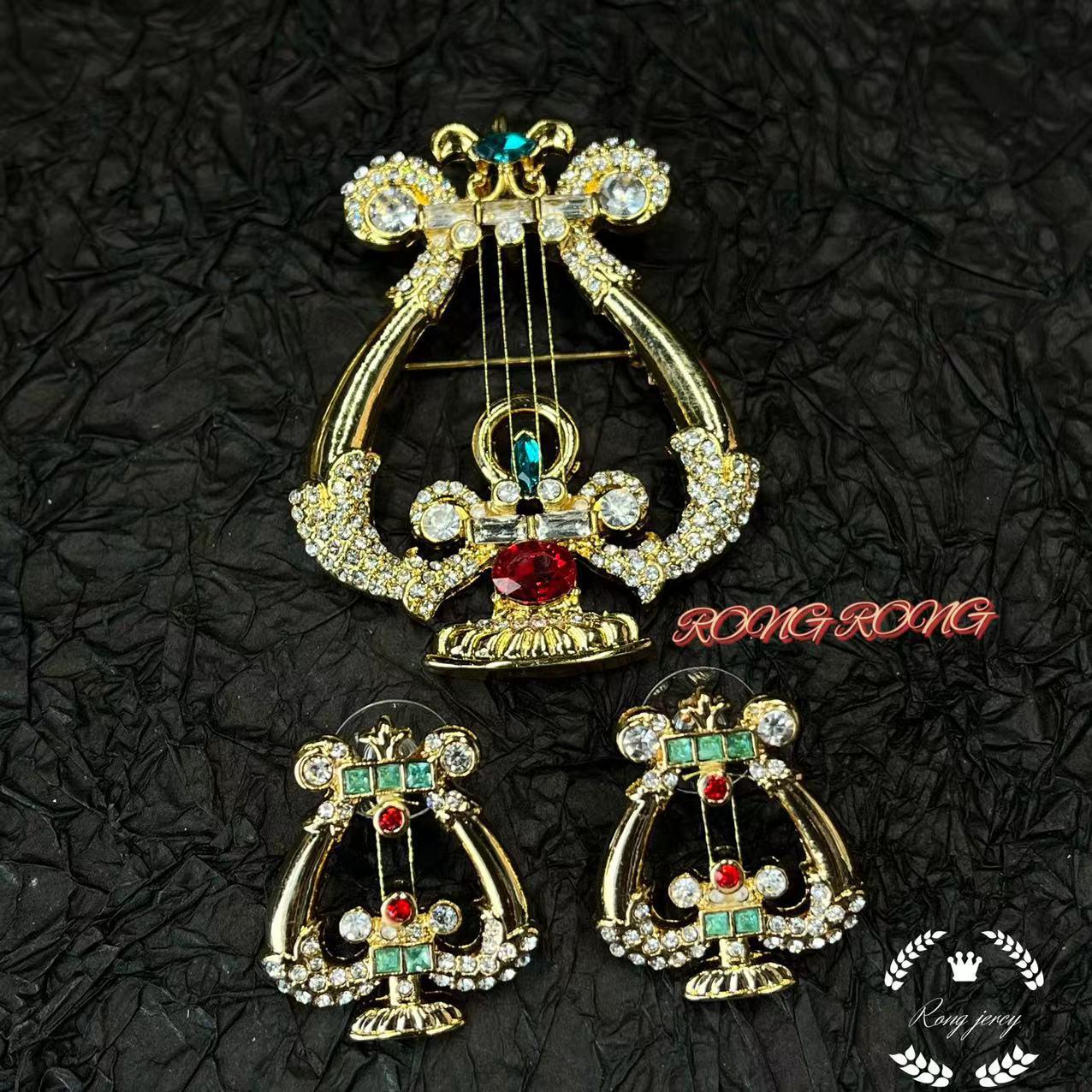 

Vintage Gold-Plated Rhinestone Harp Earrings and Elegant Brooch Set