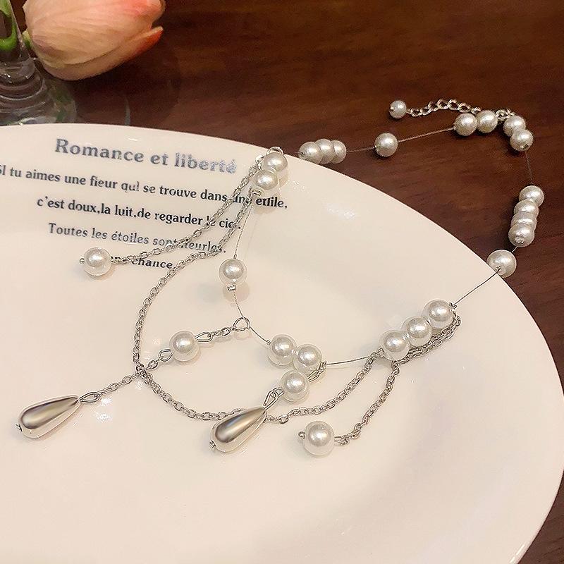 Náhrdelník s perlovými kapkami a třásněmi ženskost korálkový řetízek na klíční kost smysl pro design francouzský retro zápas