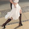 Elegant French White Irregular Half Skirt with Flowing Drape, Side Tie, and Low Waist Design