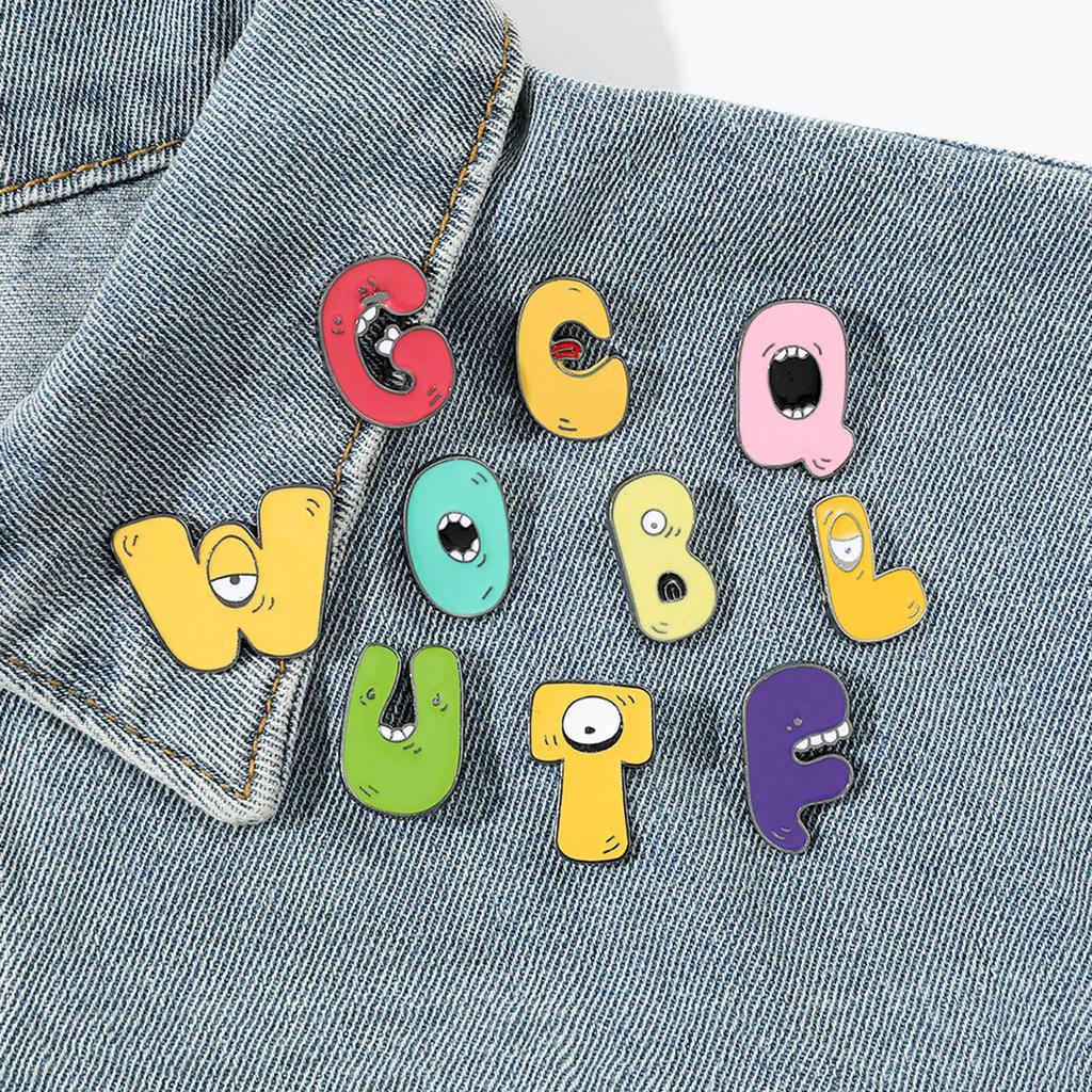 26Pcs Alphabets Enamel Pins Cartoon Letter Legend Brooch Metal Lapel Pins Hat School Bag Badges Jewelry Accessory Gift