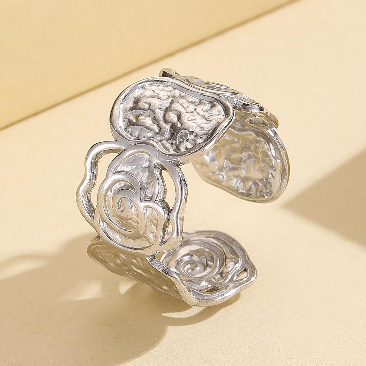 Retro Hollow Flower Stainless Steel Ring with Irregular Hammered Texture