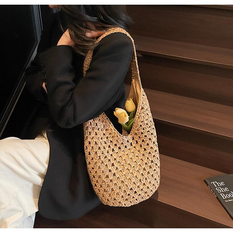 Neue hohle Stroh-Tragetasche Damen Strandurlaubsstil Lässige Schulter-Strandtasche Große Kapazität Stroh gewebte Tragetasche