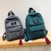 Women Mini Backpack Casual Travel School Bag Lightweight Daypack Small Shoulder Backpack with Front Pocket Tassel Pendant