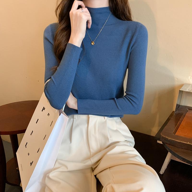 Nuevo invierno ajustado tejido de punto Color sólido cuello redondo señoras moda camisa por el trasero suéter mujer ropa
