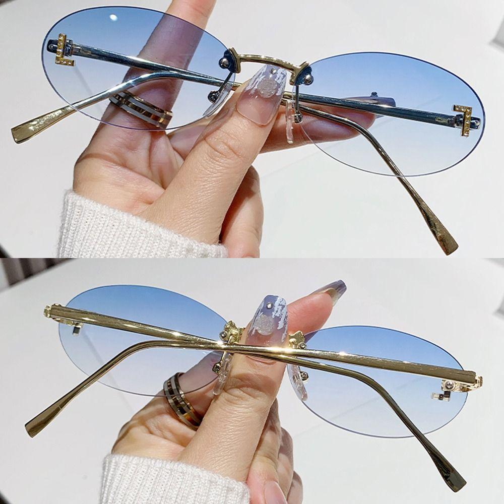 Modische ovale Sonnenbrille für Damen, Luxusqualität, Buchstabendekor, Sonnenbrille, trendige randlose Katzenaugen-Brille, UV400-Schutz, Metall
