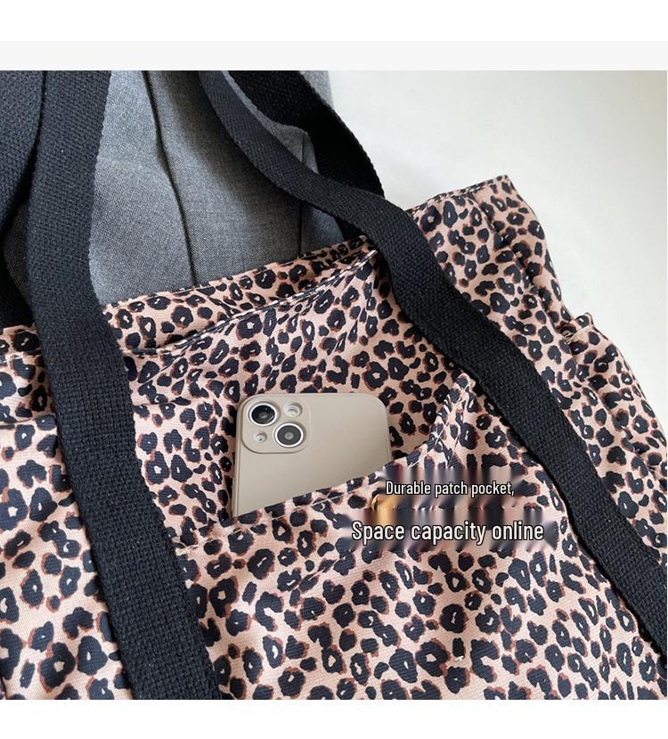 Leopard Print Canvas Tote: Large Capacity Autumn Shoulder Bag for Women, Versatile for College and Commute.