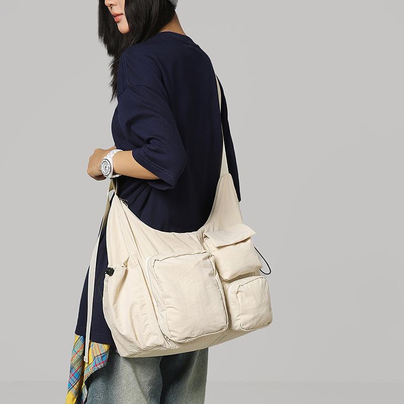 Crossbody bag Women's Japanese simple and lightweight neutral messenger bag Solid color sports and leisure shoulder bag Lightweight student backpack