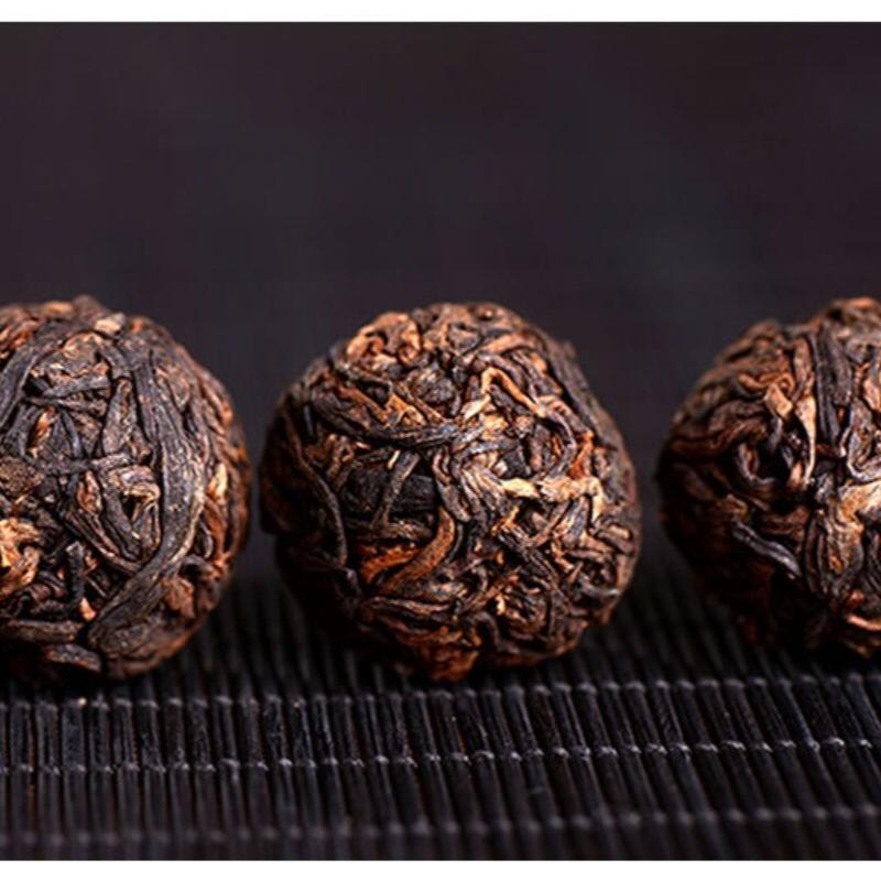 Yunnan Drakenparel Rijpe Pu-erh Thee Premium Mini Tuo Ballen 500g
